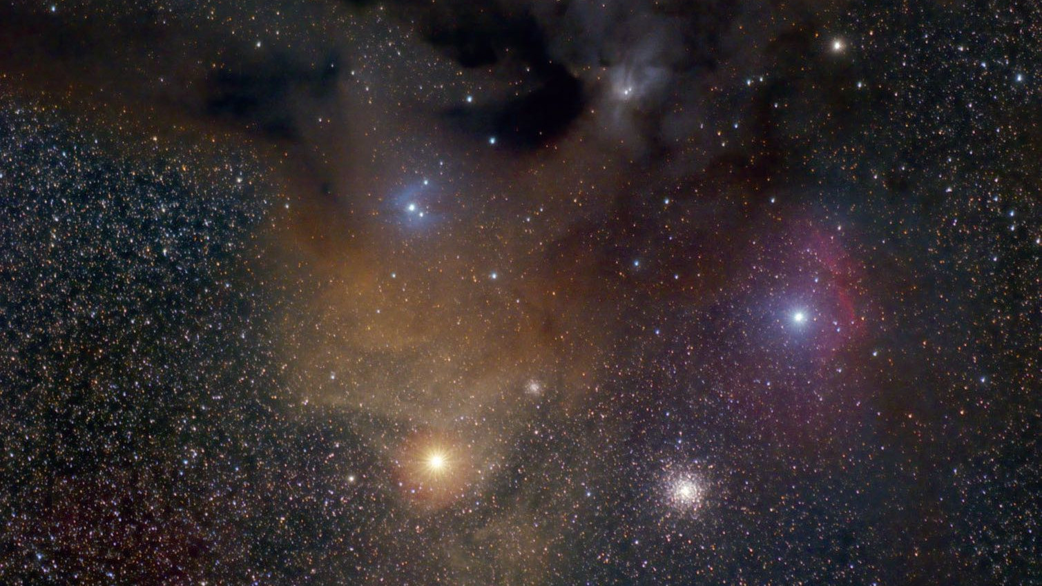 The colourful Rho Ophiuchi Nebula Complex and its surroundings: Antares is the bright, orange star below the nebula complex, to the right of it is the globular cluster M4. Jim Thommes