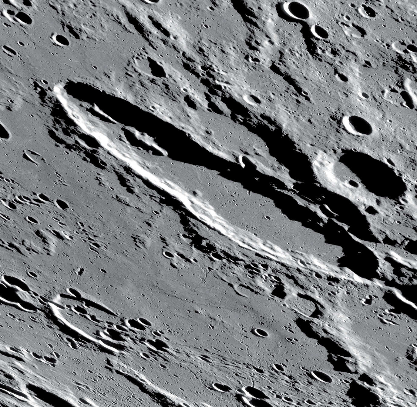 The linear mountain range in the north-western half of the crater is also striking. NASA/GSFC/Arizona State University