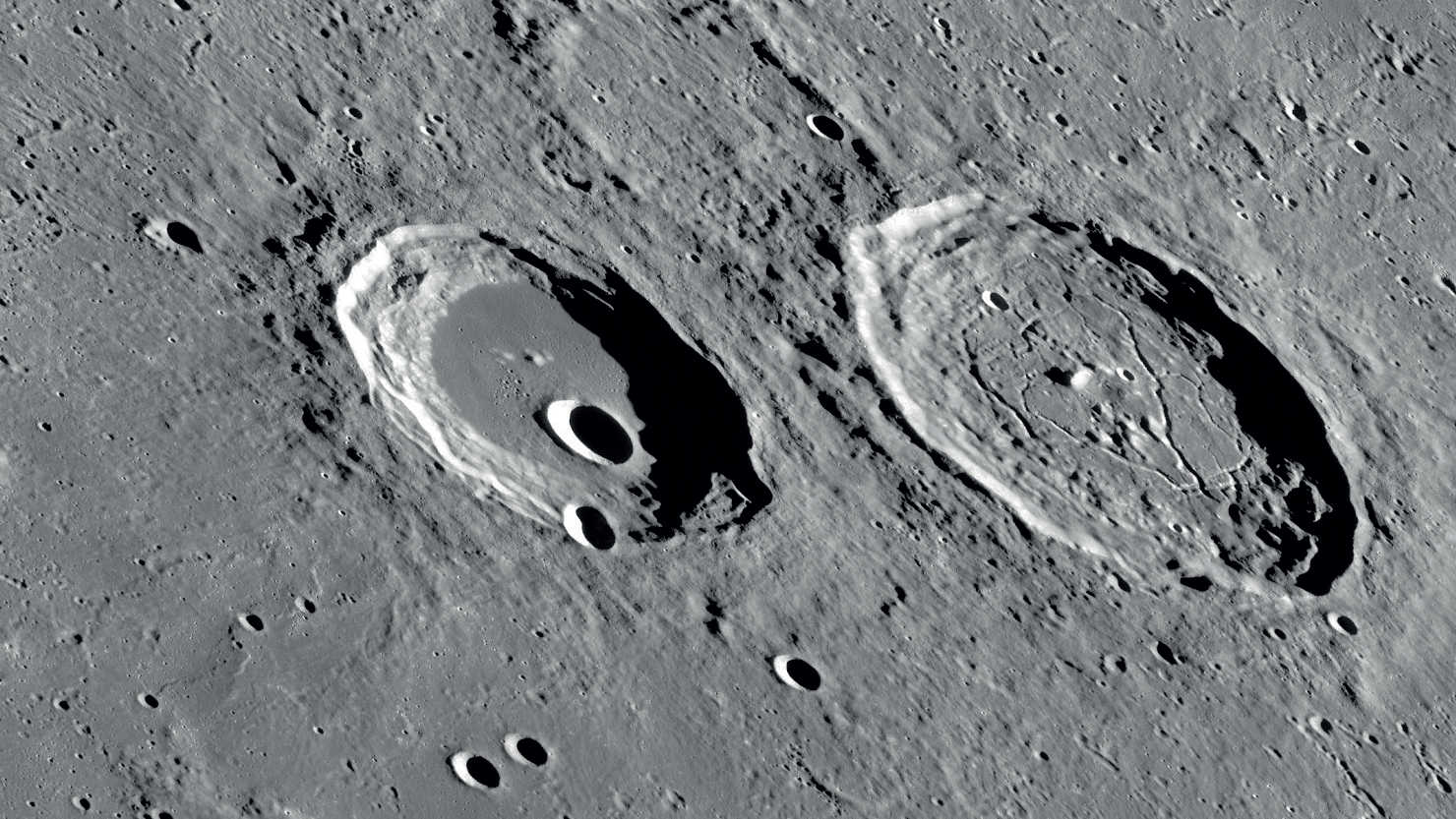 The two craters, Atlas and Hercules, appear to be very different. 
NASA/GSFC/Arizona State University
