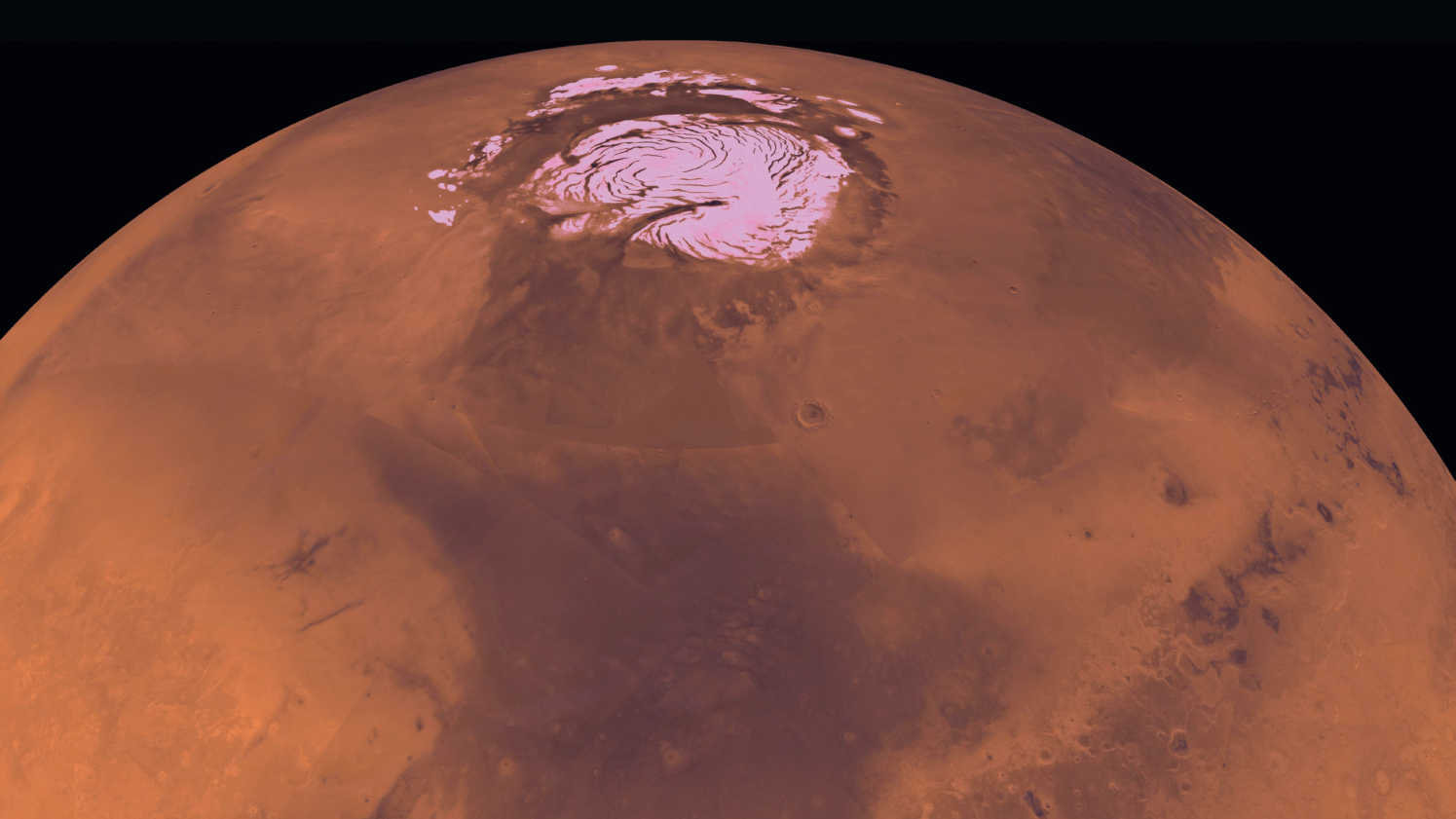 Photograph of Mars from orbit with a view of the polar cap. NASA/JPL/USGS