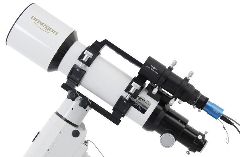 The image shows a guidescope mounted parallel to the telescope. The blue camera is aligned with a guide star. It sends control pulses to the mount via a connected computer.